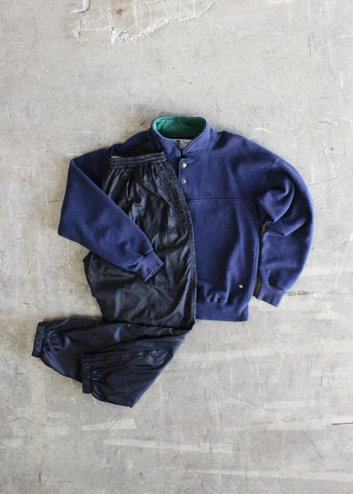 Authentic 1990s Russell Made in USA pullover mock neck with snaps paired with 1980s-1990s Nike track pants featuring a zip ankle.